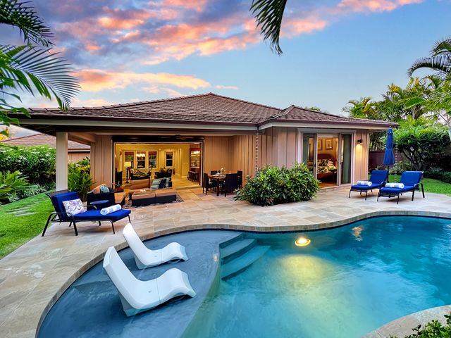 a view of swimming pool with outdoor seating