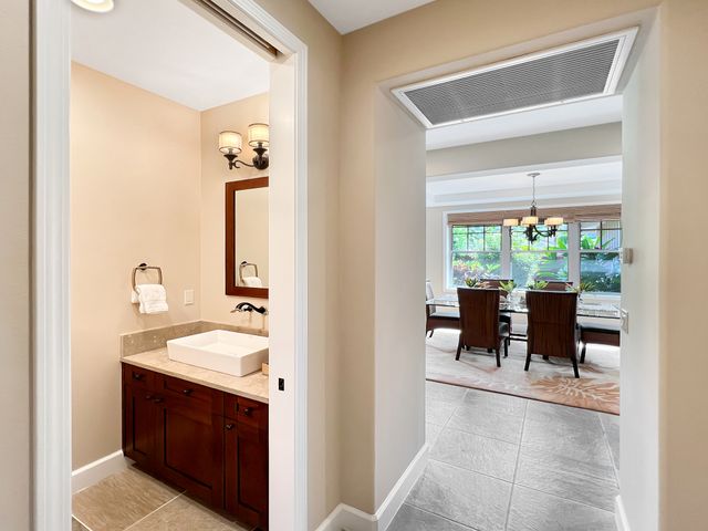 a en suite bathroom with a sink and a mirror