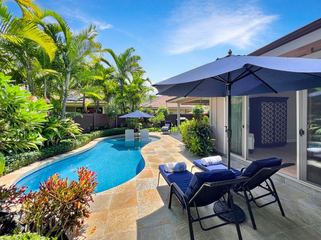 a view of a chairs and table in the patio