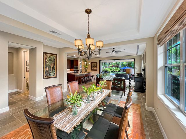 a living room with fireplace furniture and a chandelier