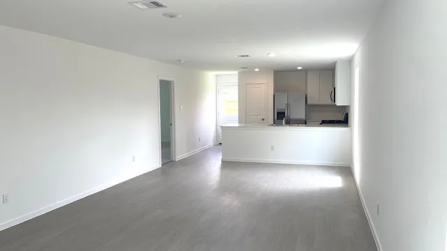 a view of a kitchen with a sink and a window