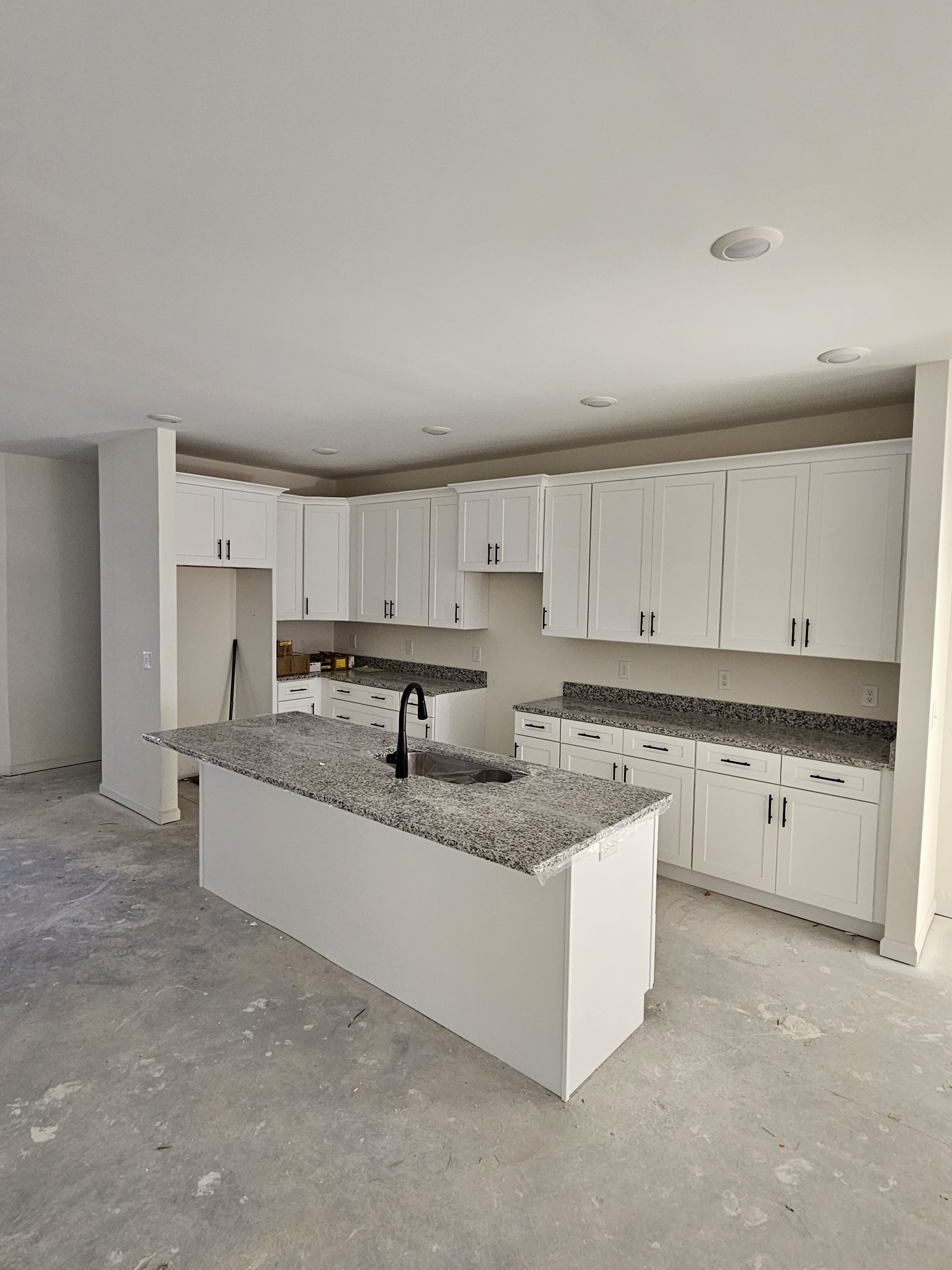 29 North Ballard Road Manchester, TN 37355 - Photo 8 of 24 a large white kitchen with granite countertop a sink
