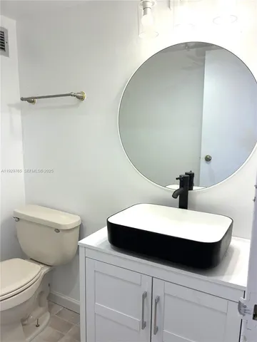 a bathroom with a shower and a toilet