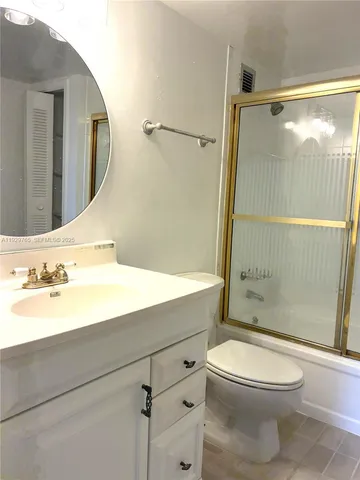 an empty room with a empty space and windows