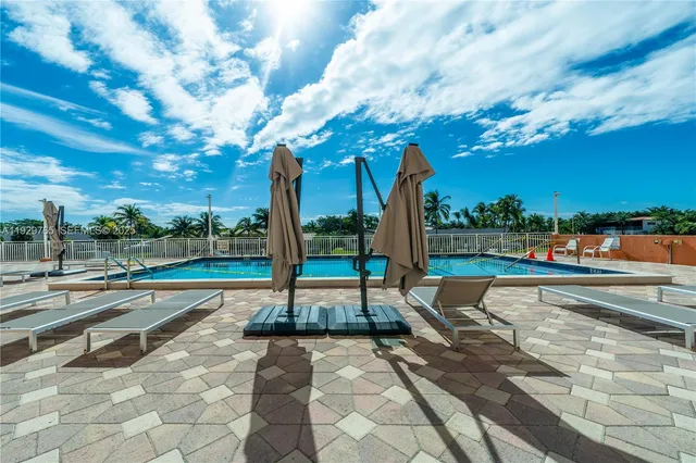 front view of a building with a garden