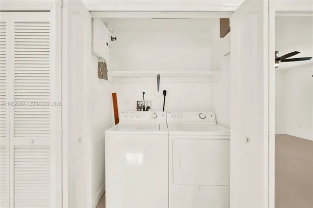 a utility room with dryer and washer