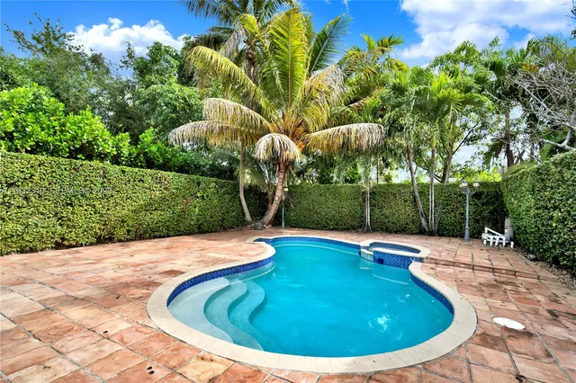 a view of a swimming pool with an outdoor space