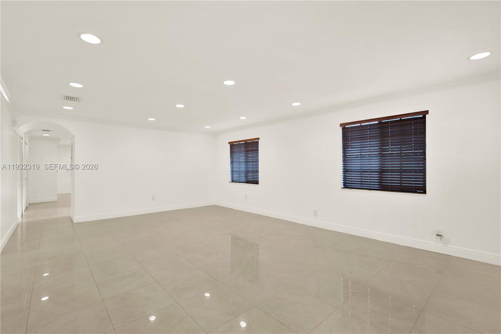 2237 Southwest 63rd Avenue Miami, FL 33155 - Photo 5 of 28 an empty room with a kitchen and a window