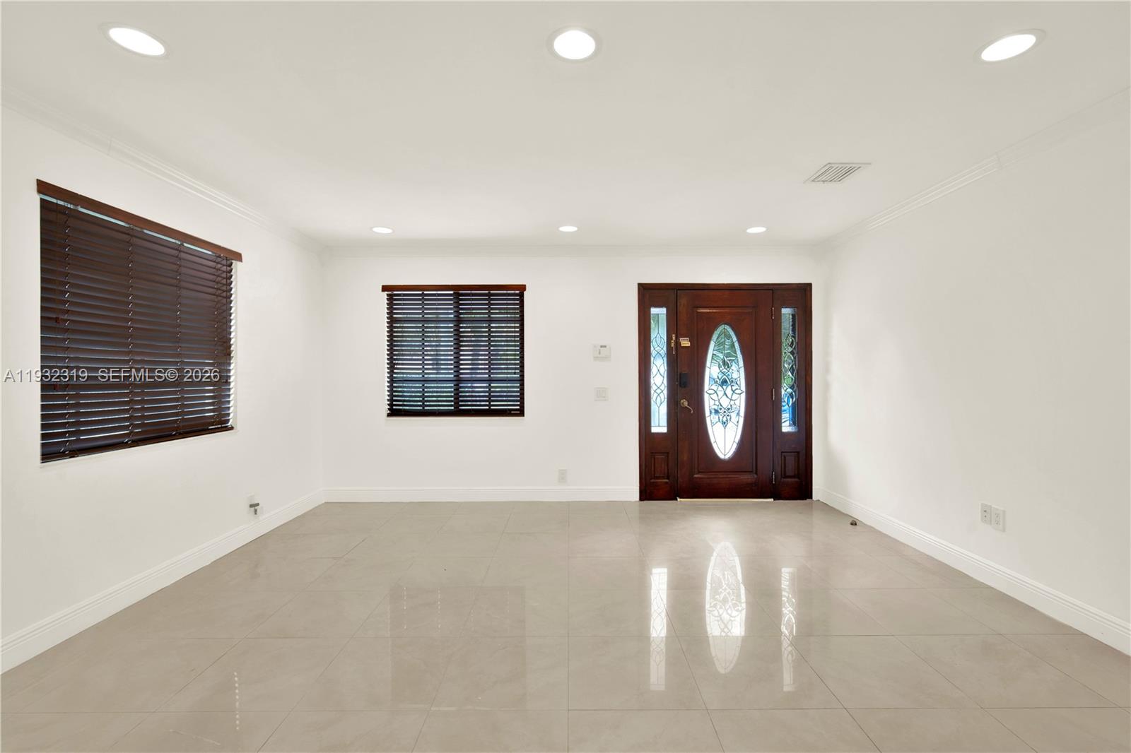 2237 Southwest 63rd Avenue Miami, FL 33155 - Photo 8 of 28 an empty room with windows