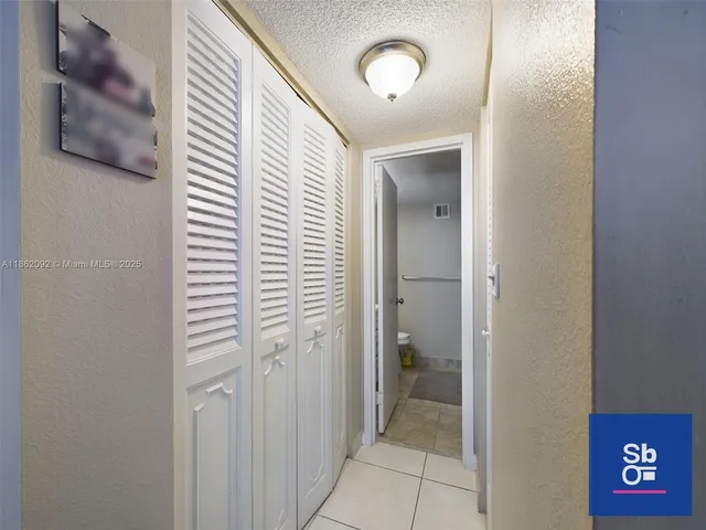 a view of a bathroom from a hallway
