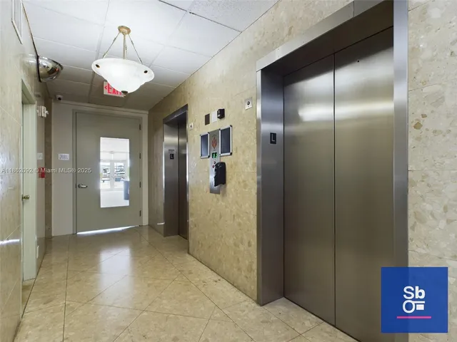 a view of a hallway with a chandelier