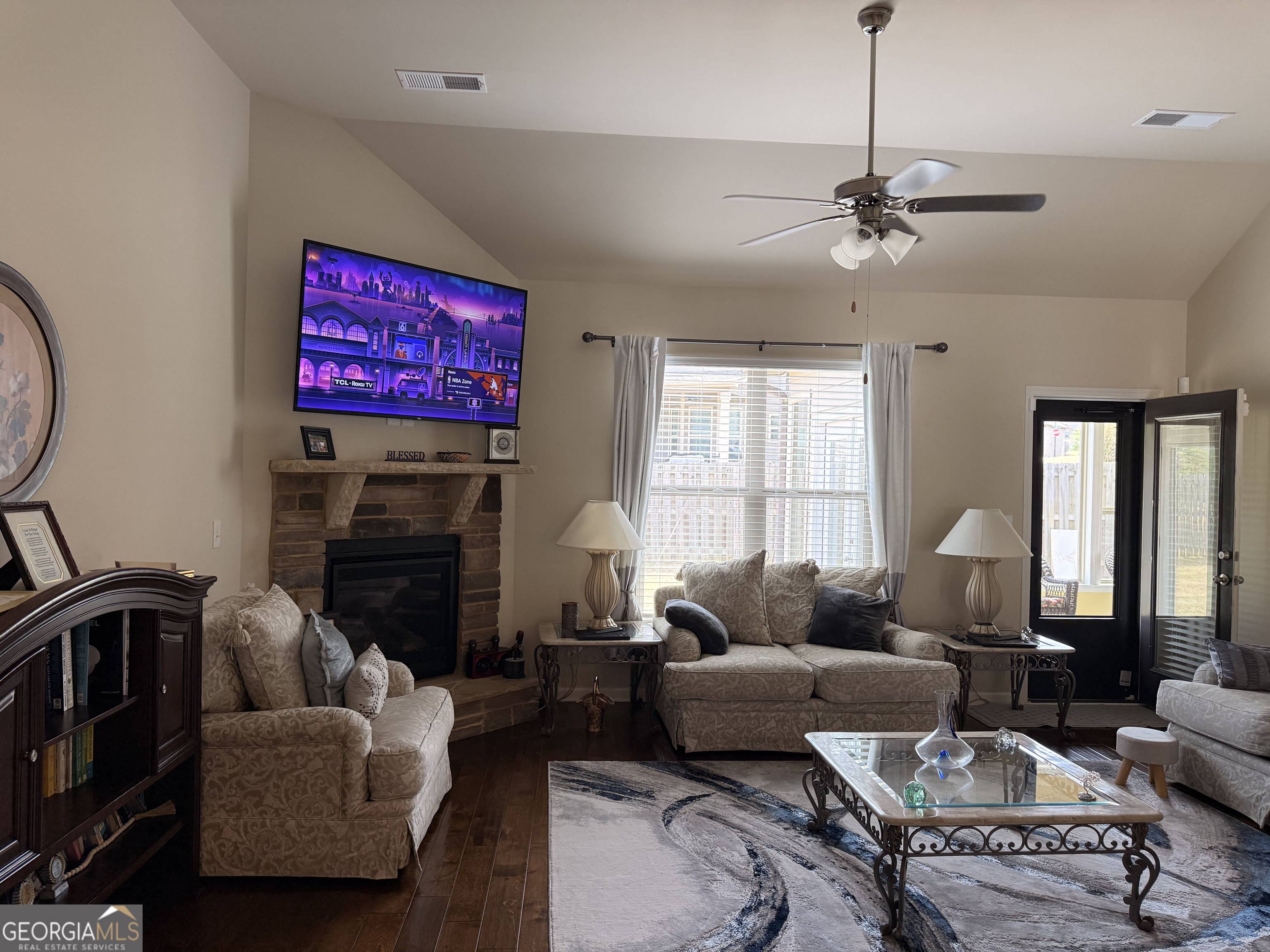 260 Silver Ridge Road Covington, GA 30016 - Photo 14 of 35 a living room with furniture and a fireplace