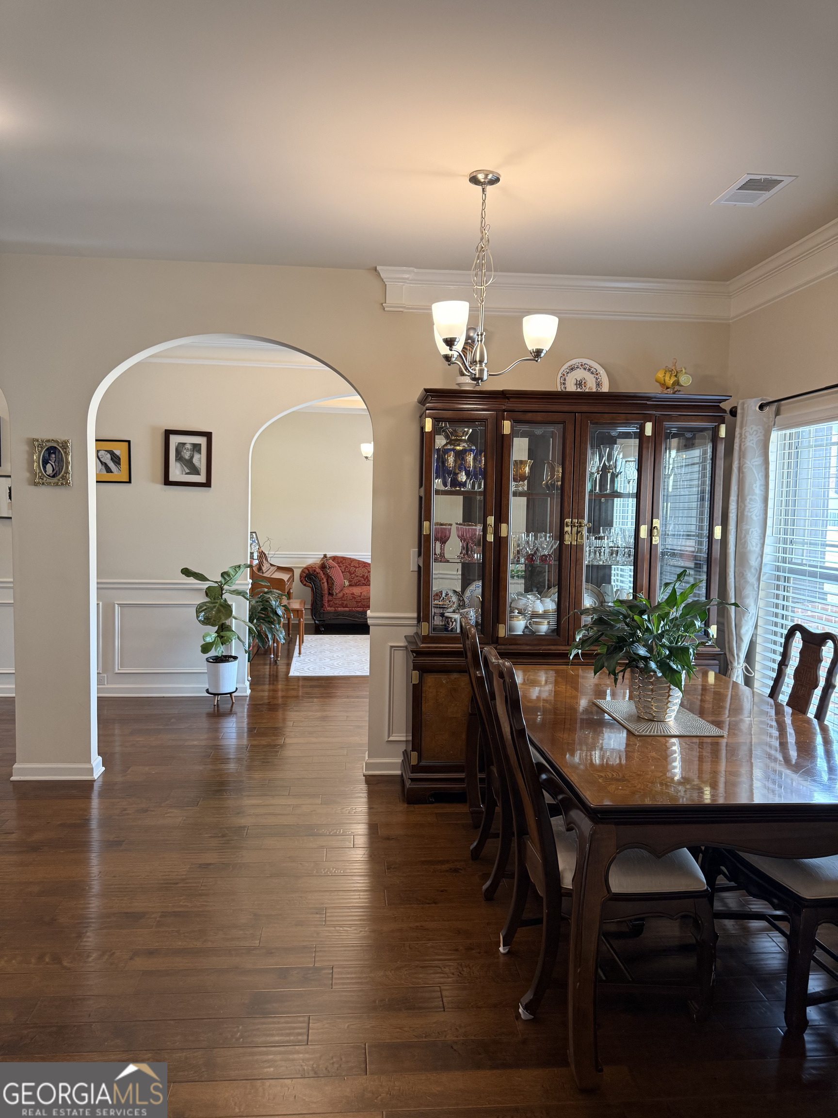 260 Silver Ridge Road Covington, GA 30016 - Photo 17 of 35 a view of a dining room with furniture window and wooden floor