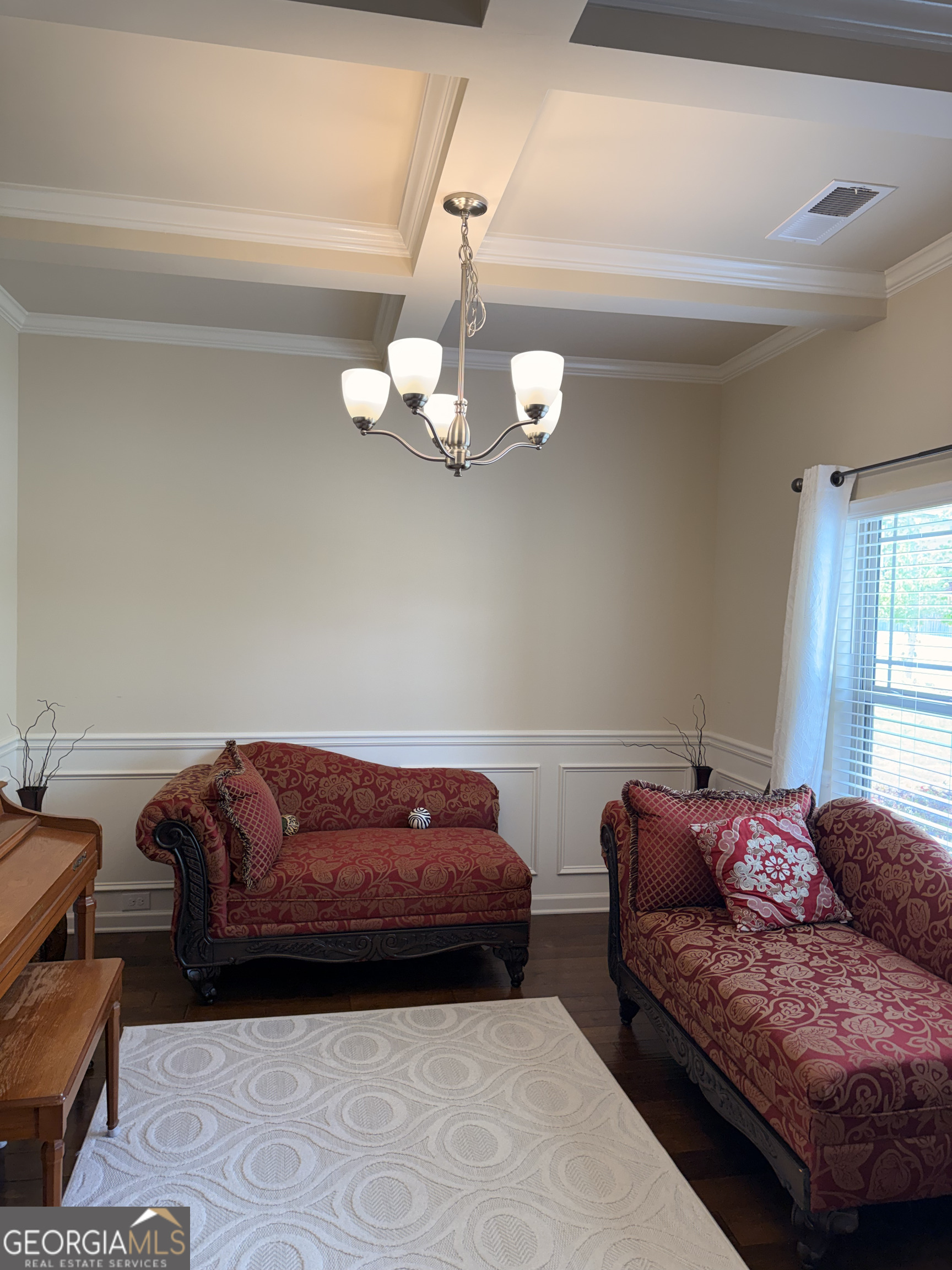 260 Silver Ridge Road Covington, GA 30016 - Photo 20 of 35 a bed room with a bed and a chandelier