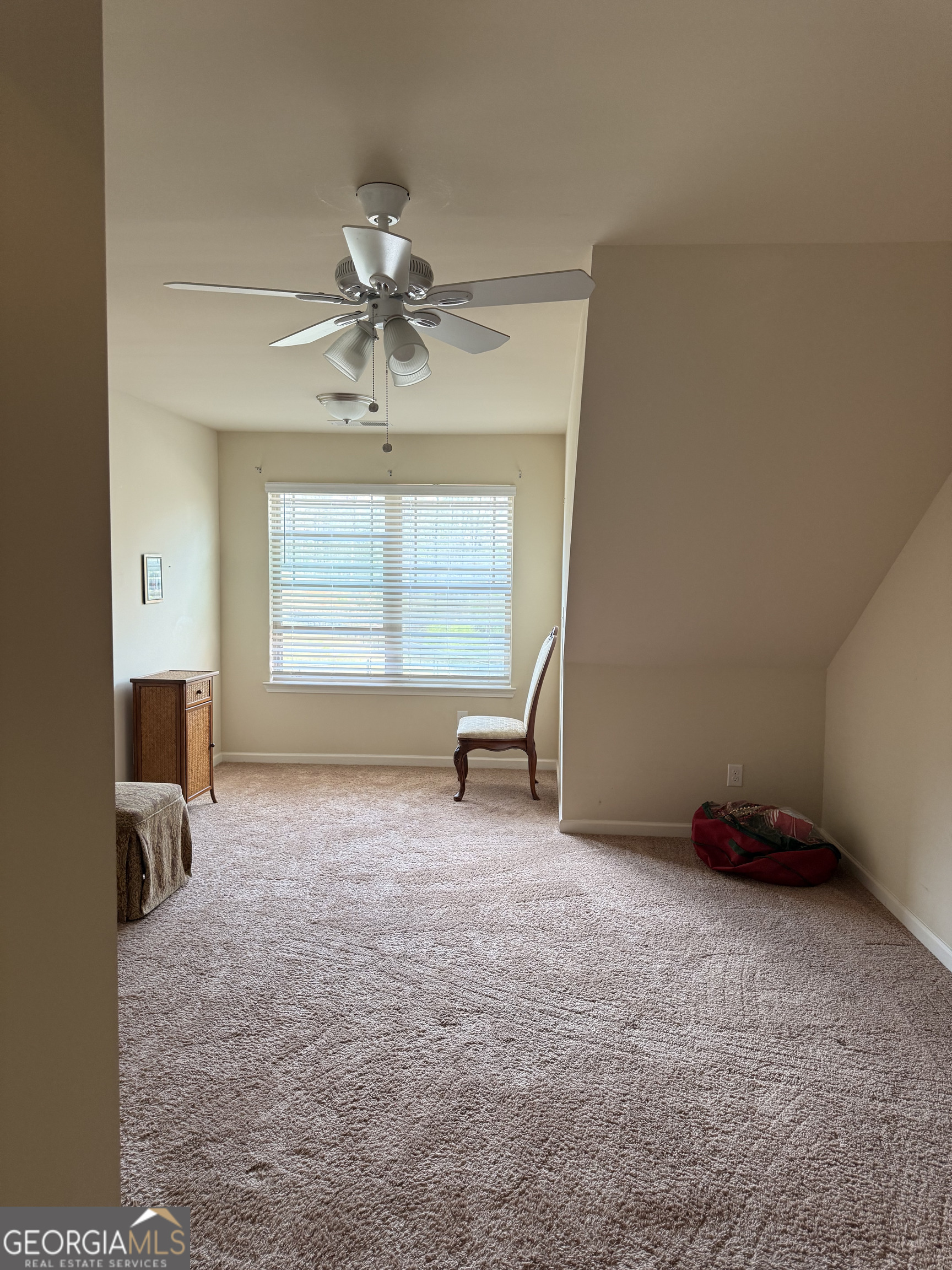 260 Silver Ridge Road Covington, GA 30016 - Photo 31 of 35 a big room with chandelier fan and windows