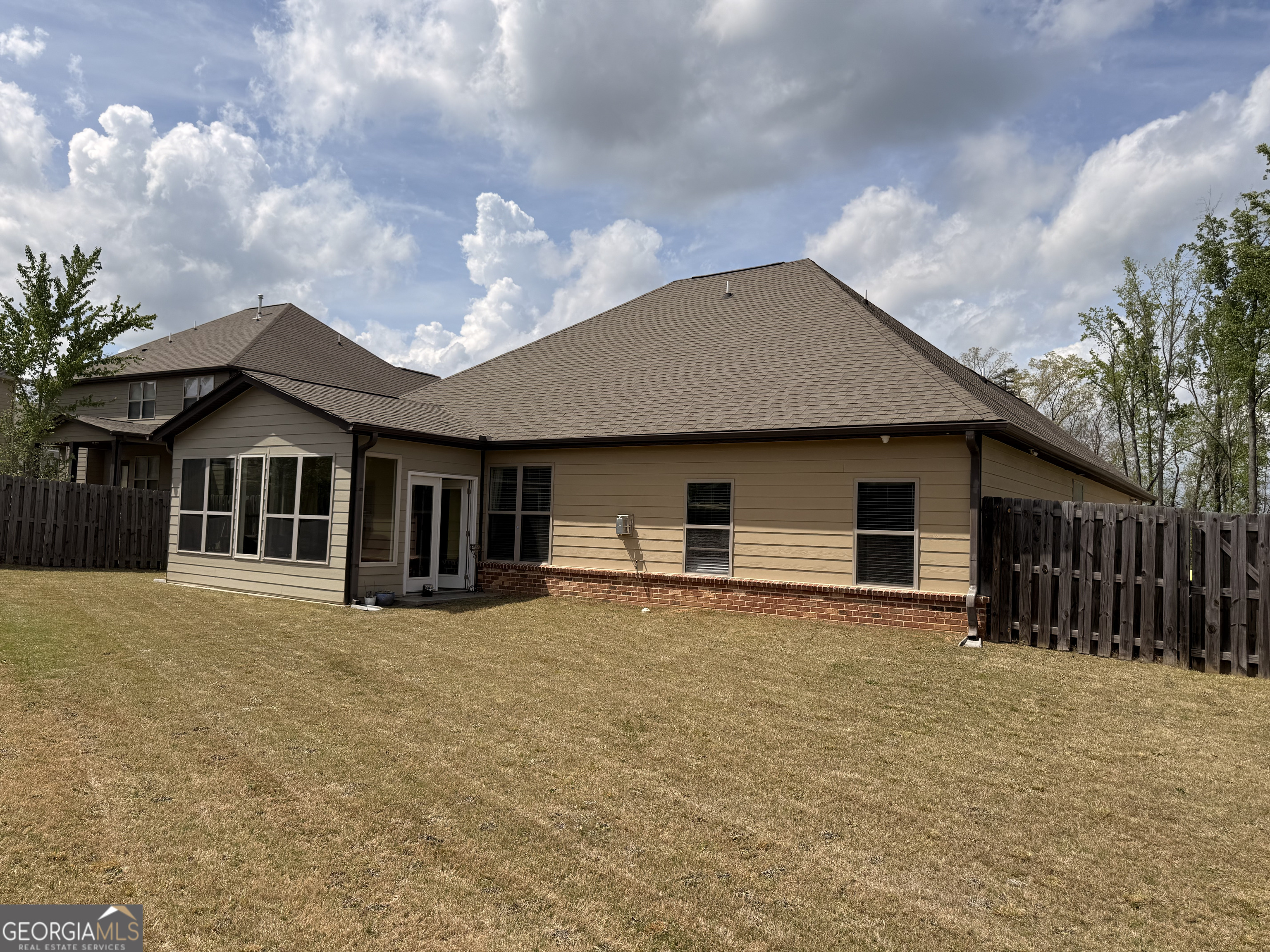 260 Silver Ridge Road Covington, GA 30016 - Photo 35 of 35 a front view of house with yard and trees in the background