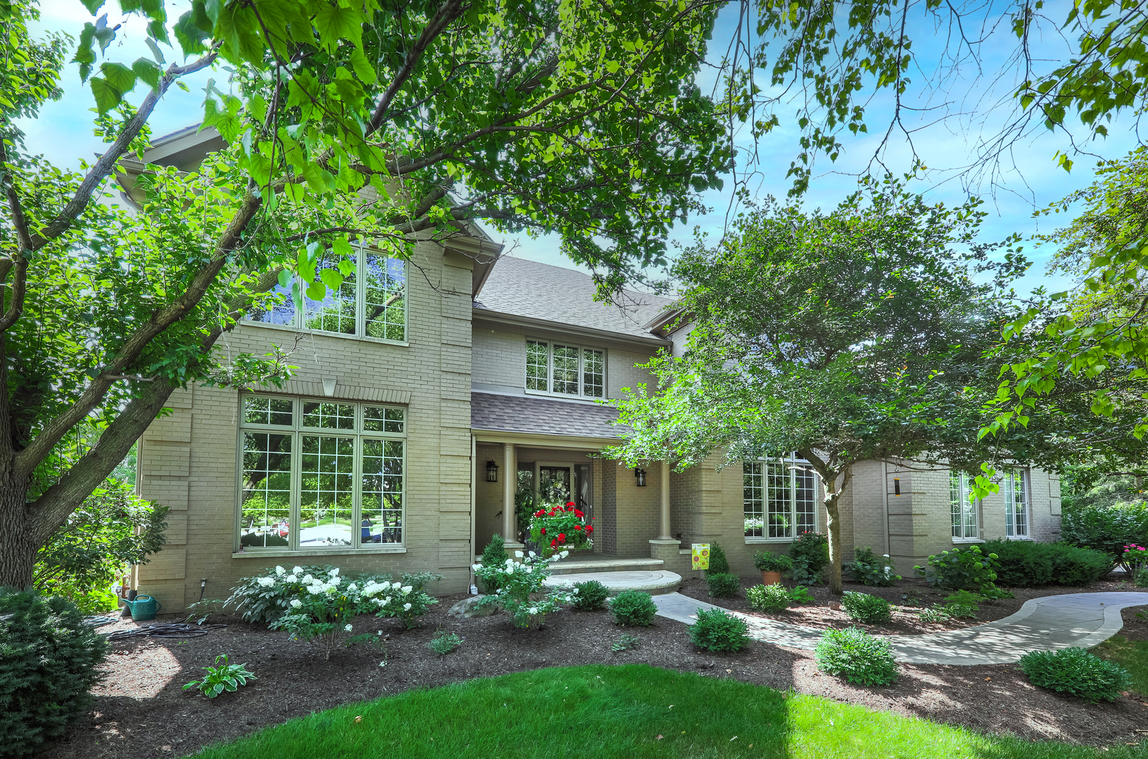 front view of a house with a yard