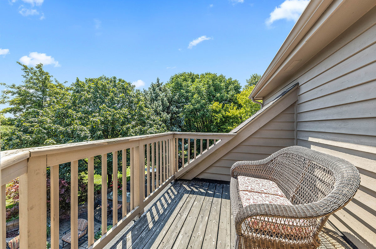 4435 Esquire Circle Naperville, IL 60564 - Photo 19 of 45 a balcony with wooden floor and stairs