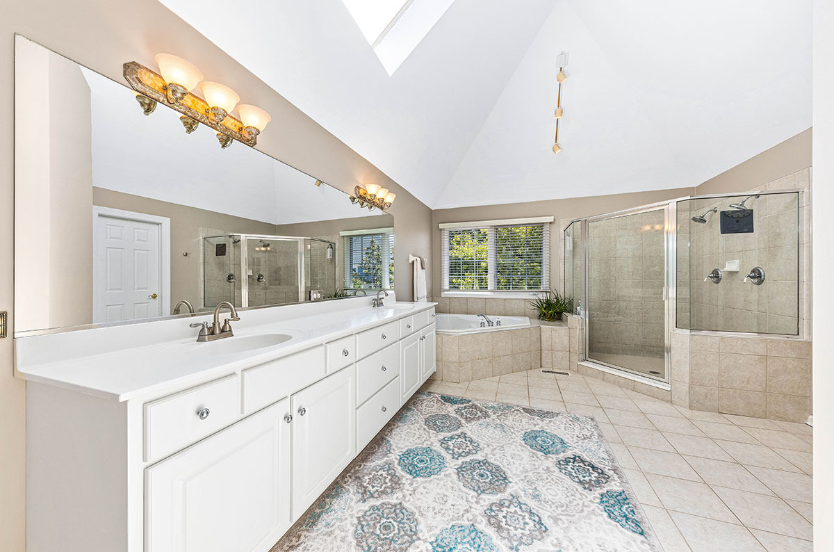 4435 Esquire Circle Naperville, IL 60564 - Photo 20 of 45 a large white bathroom with a large mirror
