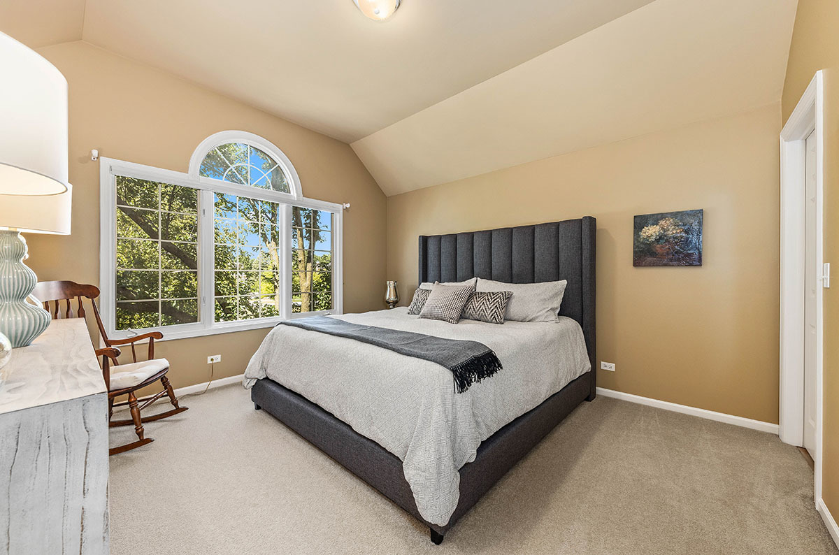 4435 Esquire Circle Naperville, IL 60564 - Photo 22 of 45 a bed sitting in a bedroom next to a window