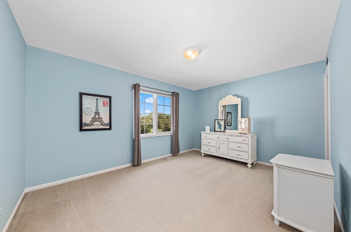 4435 Esquire Circle Naperville, IL 60564 - Photo 24 of 45 a living room with furniture and a window