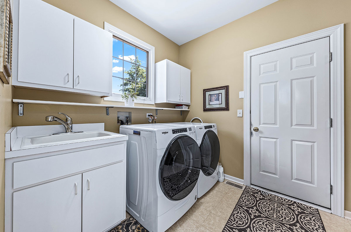 4435 Esquire Circle Naperville, IL 60564 - Photo 27 of 45 a utility room with sink dryer and washer