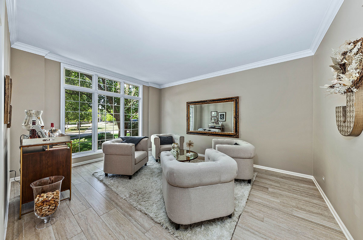 4435 Esquire Circle Naperville, IL 60564 - Photo 4 of 45 a living room with furniture and a large window
