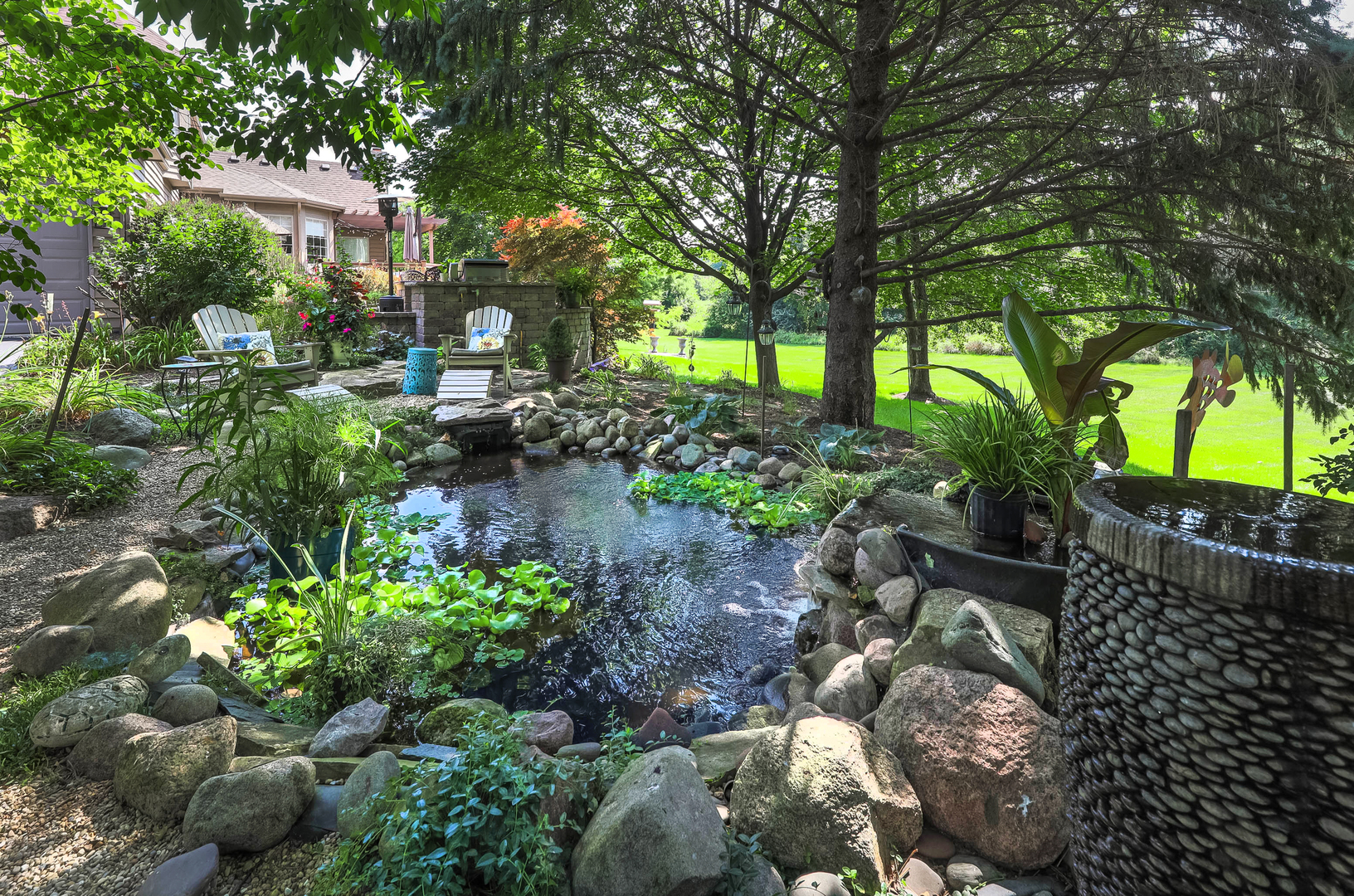 4435 Esquire Circle Naperville, IL 60564 - Photo 35 of 45 a backyard of a house with lots of green space and trees all around