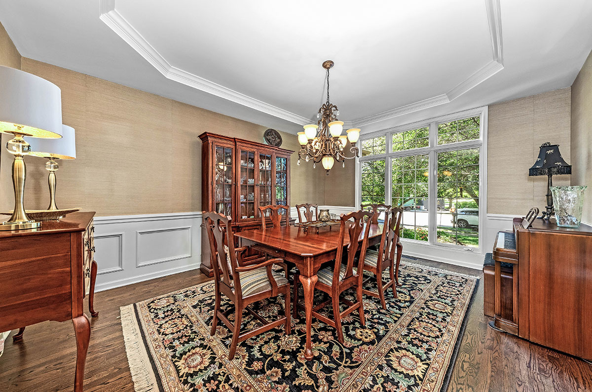 4435 Esquire Circle Naperville, IL 60564 - Photo 5 of 45 a dining room with furniture a chandelier and wooden floor
