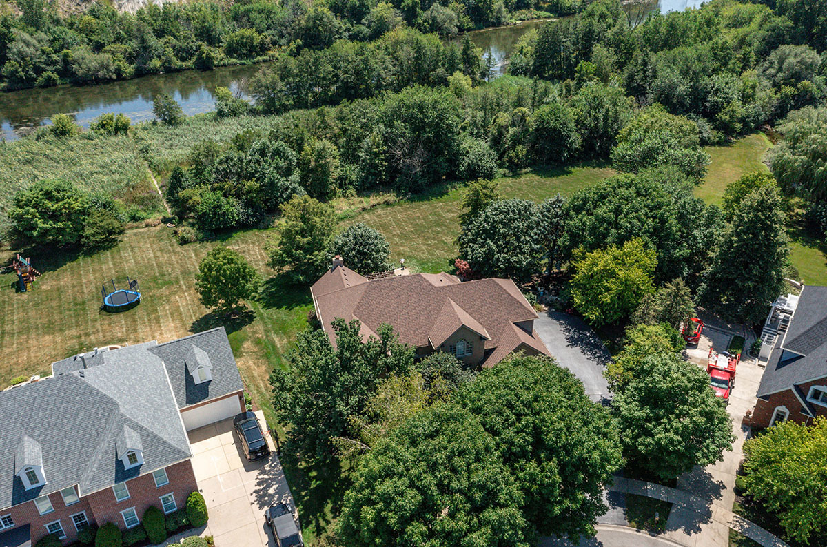 4435 Esquire Circle Naperville, IL 60564 - Photo 41 of 45 an aerial view of a house with a garden and lake view