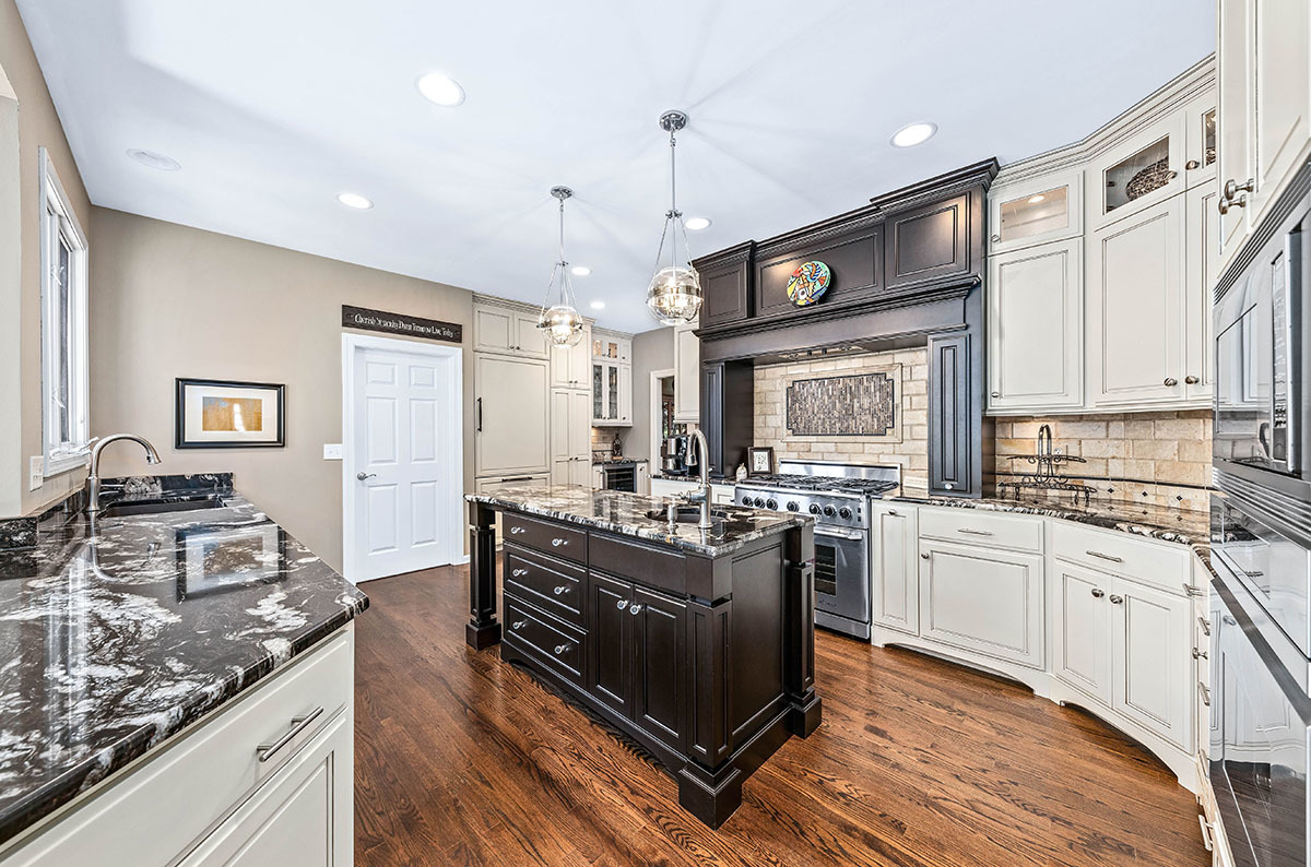 4435 Esquire Circle Naperville, IL 60564 - Photo 10 of 45 a kitchen with stainless steel appliances granite countertop a stove and a sink