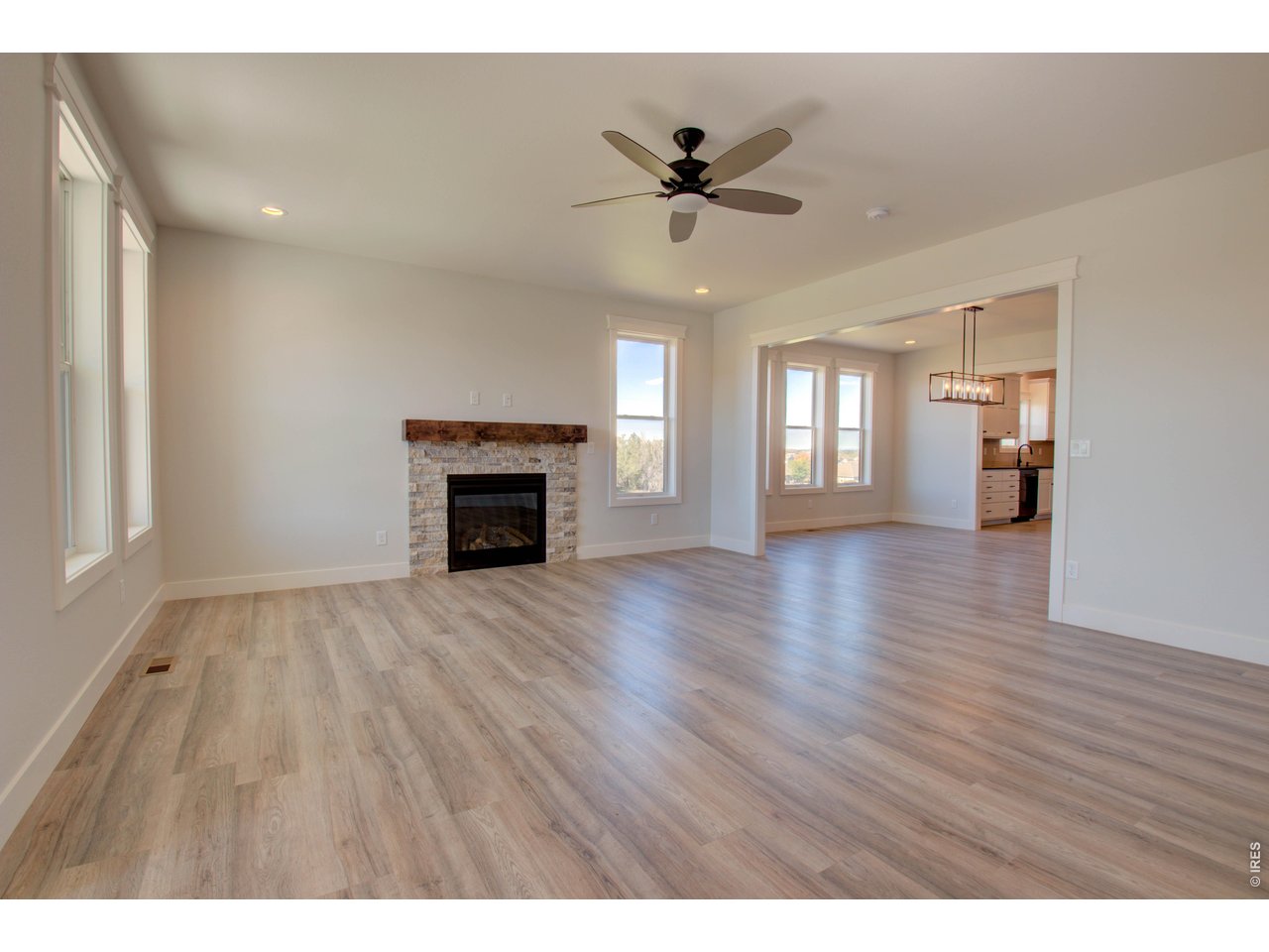 5705 2nd Road Greeley, CO 80634 - Photo 9 of 46 The beautiful lighting and ceiling fans throughout the home are custom upgrades