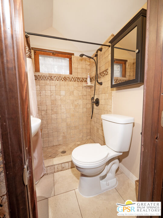 76 7 Oaks Road Angelus Oaks, CA 92305 - Photo 13 of 35 a bathroom with a toilet and a shower
