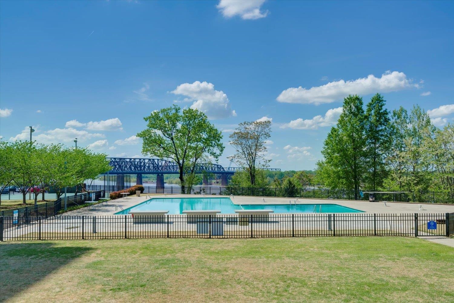 655 Riverside Drive, Unit 202 Memphis, TN 38103 - Photo 35 of 37 a view of a swimming pool with a garden