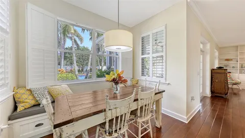 a kitchen with stainless steel appliances granite countertop a sink a stove a microwave and wooden cabinets