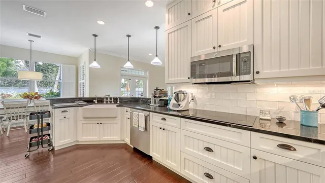 a spacious bedroom with a bed and a dresser