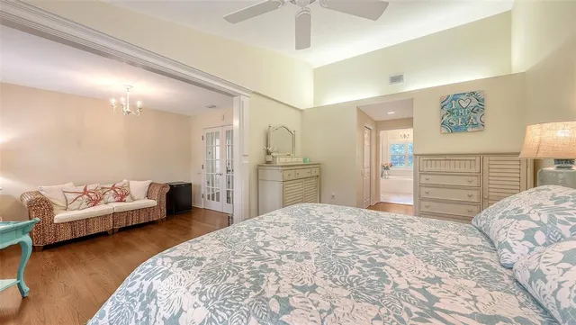 a bedroom with a bed and a bookshelf