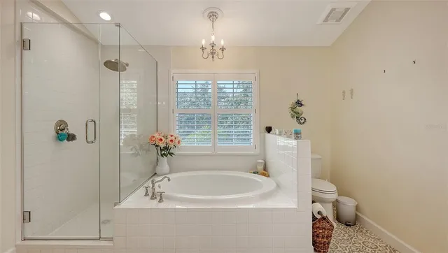 a bedroom with a large bed and a book shelf