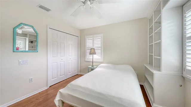 a bathroom with a granite countertop sink toilet a mirror and shower