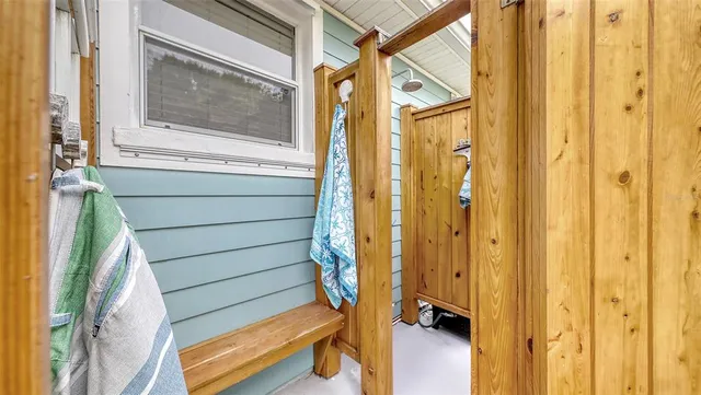 a view of sign board with flower around