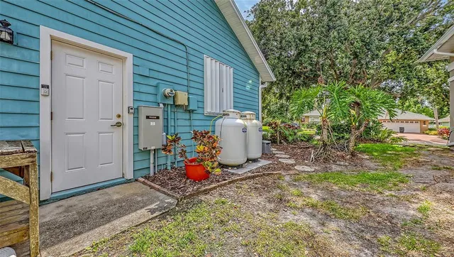 a couple of potted plants in front of door