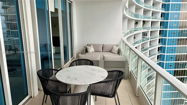 a view of a balcony and chairs