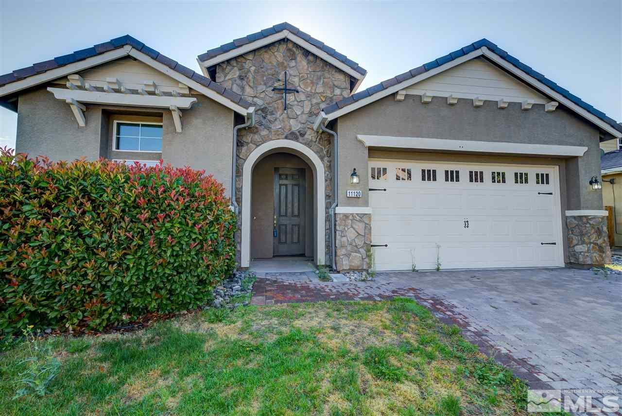 11120 Messina Way Reno, NV 89521 - Photo 1 of 1 a front view of a house with a yard and garage