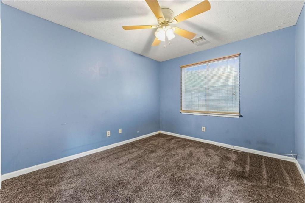 6581 Coventry Point Austell, GA 30168 - Photo 13 of 20 an empty room with windows and fan