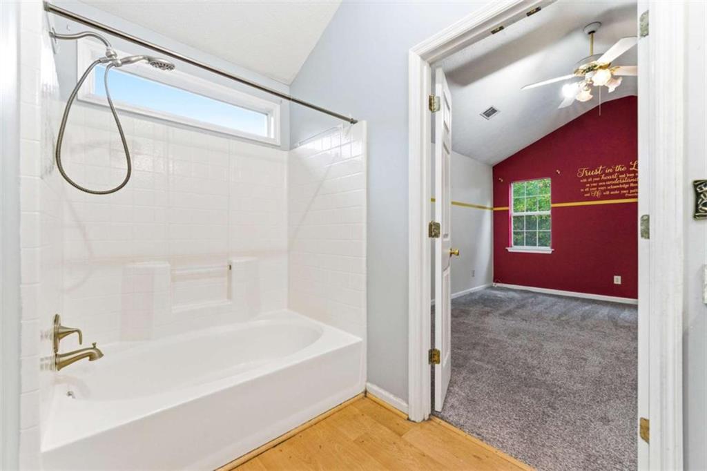 6581 Coventry Point Austell, GA 30168 - Photo 18 of 20 a bathroom with a tub shower vanity and a sink