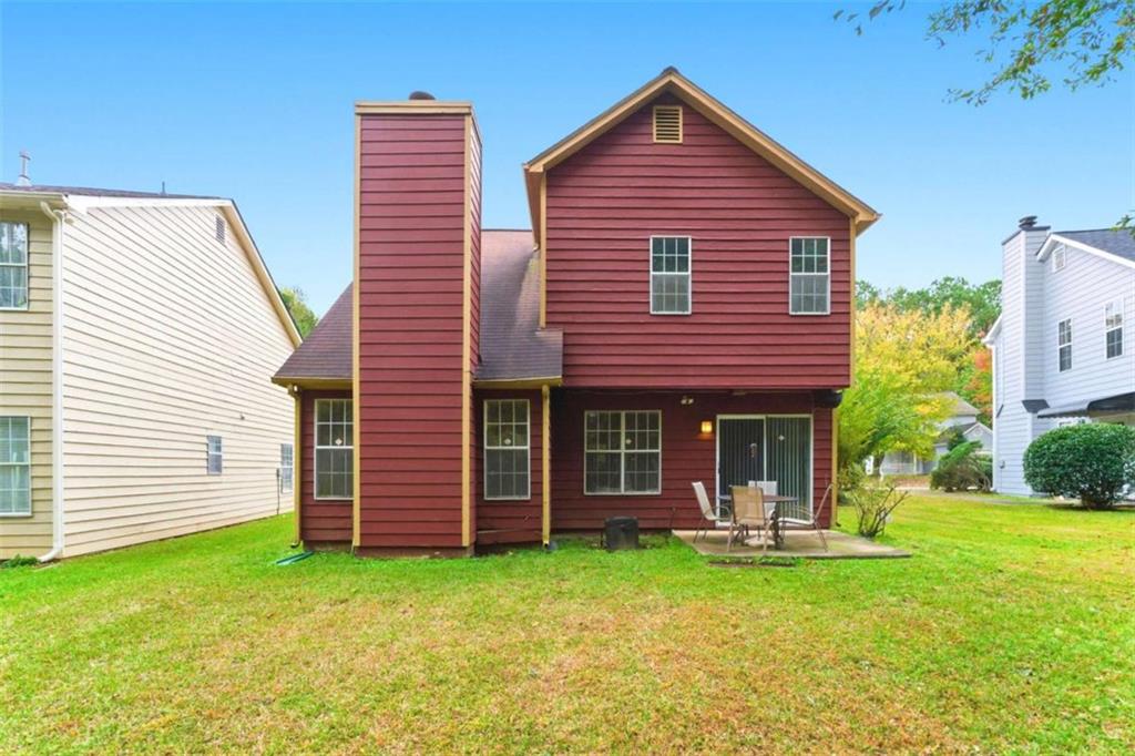 6581 Coventry Point Austell, GA 30168 - Photo 19 of 20 a front view of a house with a garden
