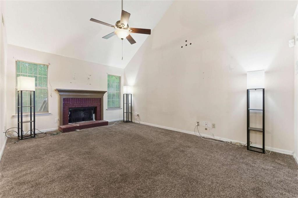 6581 Coventry Point Austell, GA 30168 - Photo 5 of 20 an empty room with fan and fireplace
