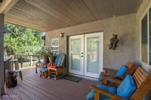 a view of outdoor space with wooden floor and outdoor seating
