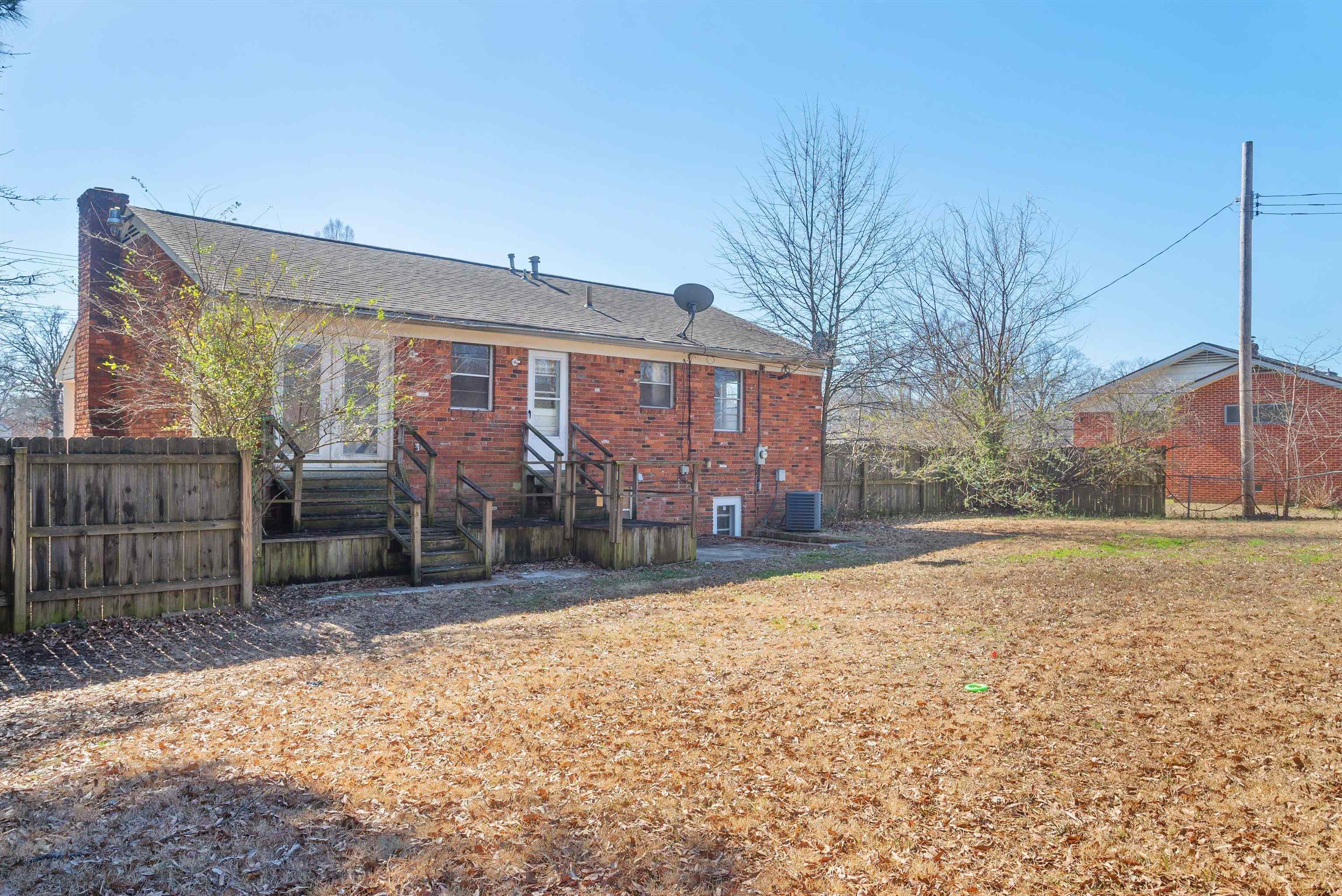 4696 Stage Road Memphis, TN 38128 - Photo 22 of 23 a view of a house with a yard and covered with snow