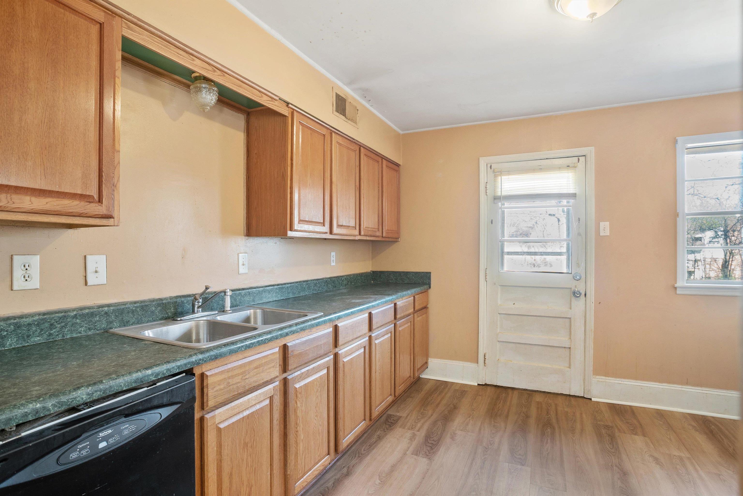 4696 Stage Road Memphis, TN 38128 - Photo 7 of 23 a kitchen that has a sink and a stove